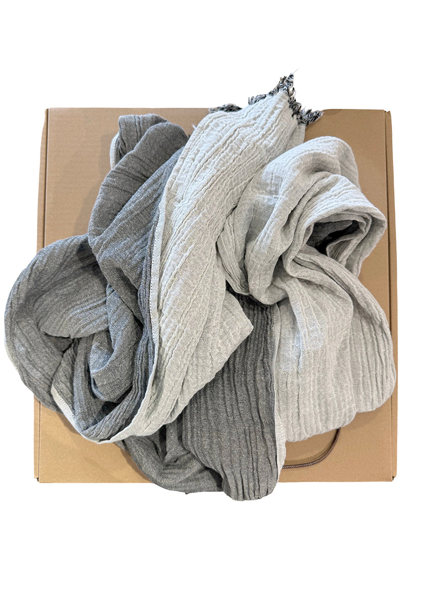 Box of gray and white socks on a white background