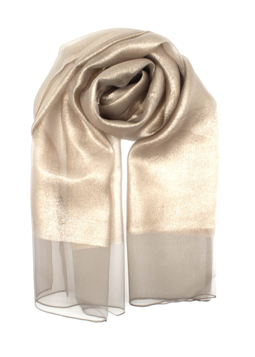 This elegant gold scarf features vibrant colors and a delicate sheer finish. The lightweight, airy fabric drapes beautifully, making it a versatile accessory for both casual and formal occasions.