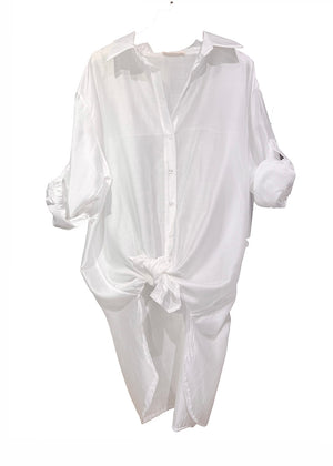 White shirt with rolled-up sleeves on a white background