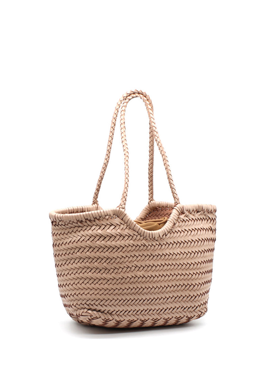Woven straw tote bag on a white background