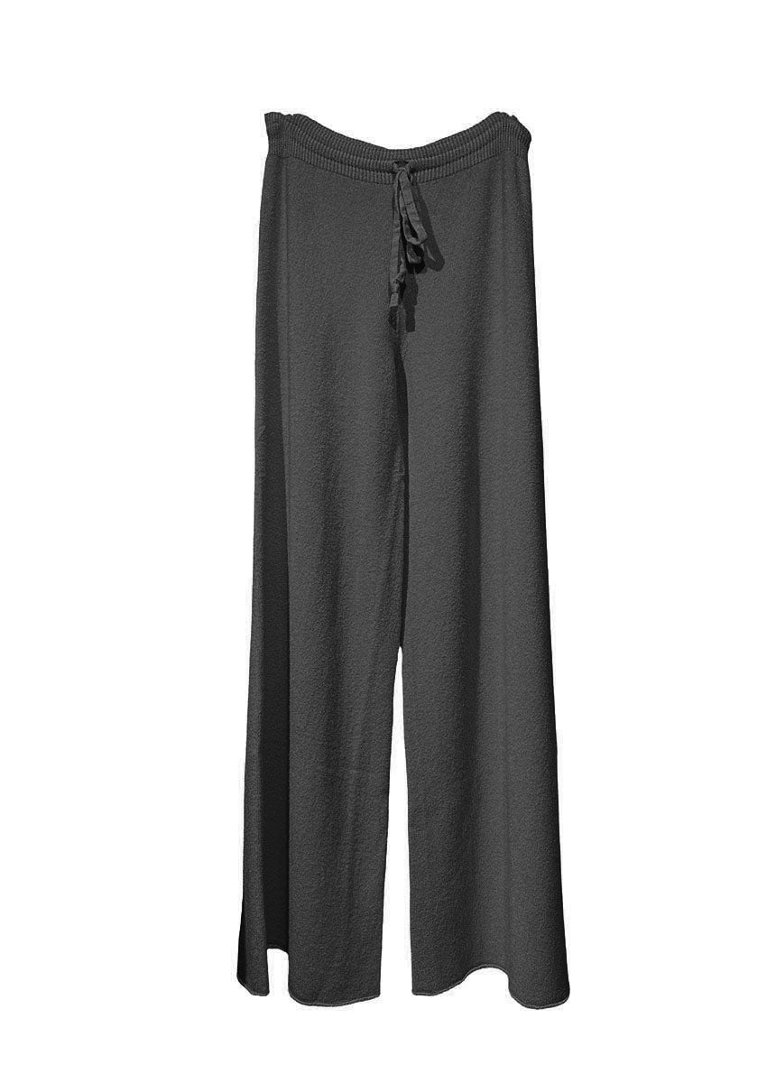 Long wide black pants made of a soft viscose blend, they feature elastic drawstring, perfect for resort lifestyle, travel comfort and fireplace parties