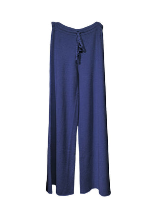Long wide blue pants made of a soft viscose blend, they feature elastic drawstring, perfect for resort lifestyle, travel comfort and fireplace parties