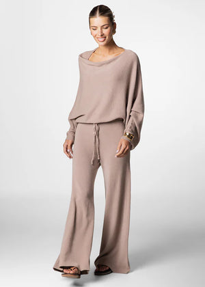 Long wide tan pants made of a soft viscose blend, they feature elastic drawstring, perfect for resort lifestyle, travel comfort and fireplace parties