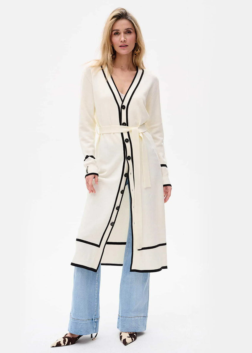 White dress cardigan with black accents on a white background