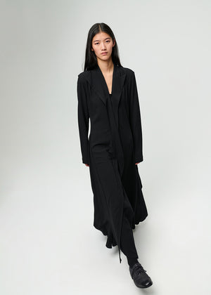 Person wearing a black dress on a white background