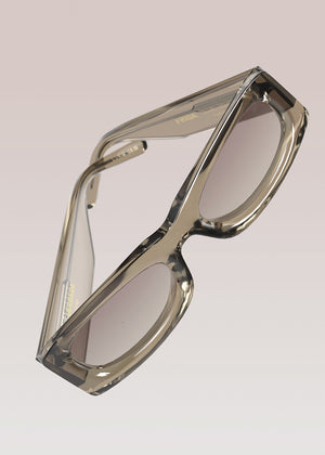 Clear frame eyeglasses on a light gray background