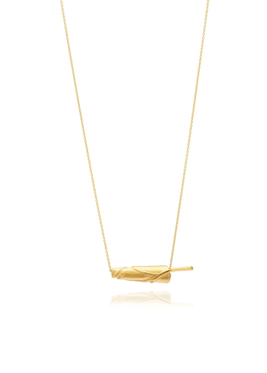 Gold necklace with a simple pendant on a white background
