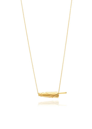Gold necklace with a simple pendant on a white background