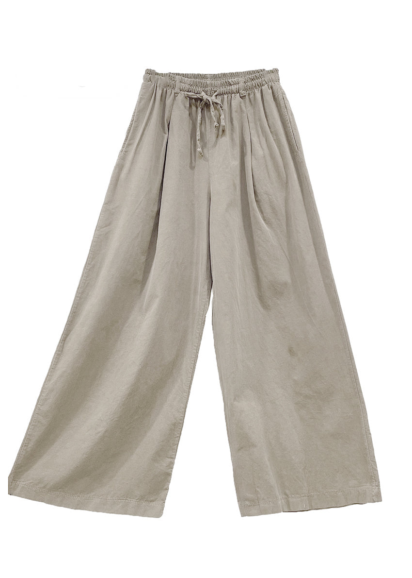 Beige wide-leg pants with drawstring waist on a white background