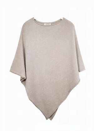 A beige poncho on a white background 
