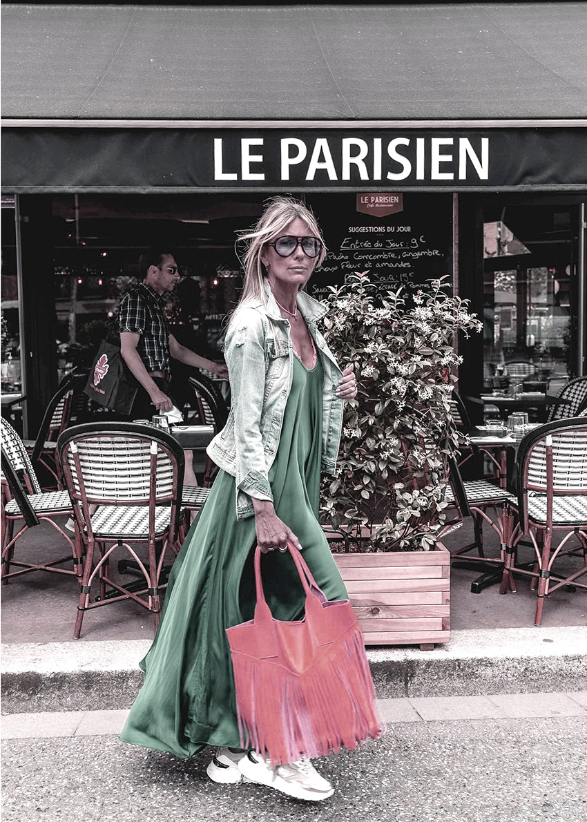 Woman walking on a street in a silk long dress