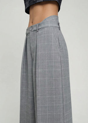Gray checkered skirt on a plain background