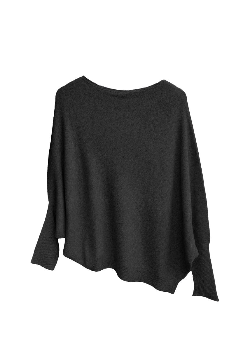 A black, asymmetrical hemline sweater with fitted sleeves that flare out into a poncho-like shape