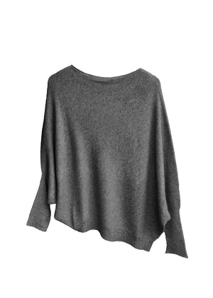 A gray, asymmetrical hemline sweater with fitted sleeves that flare out into a poncho-like shape