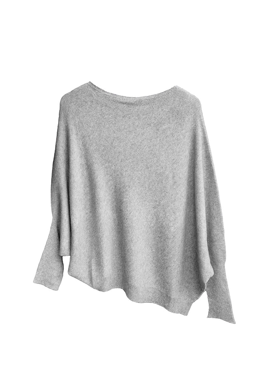 A light grey, asymmetrically cut, flow-style sweater with a neckline and a slightly uneven hem.
