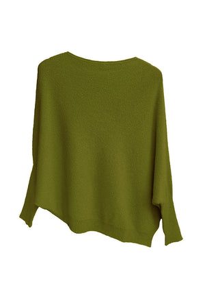 A green, asymmetrical hemline sweater with fitted sleeves that flare out into a poncho-like shape