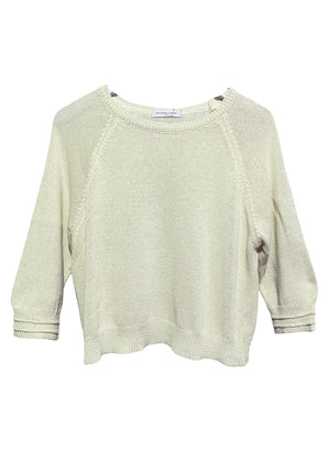 Cornsilk short sweater with 3/4 sleeves and decorative stitching on the sleeves laid flat.