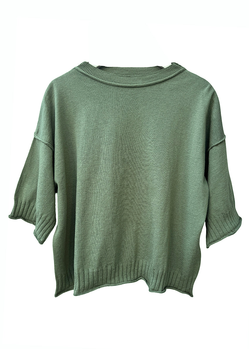 Green sweater on a white background