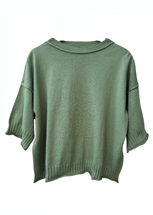 Green sweater on a white background