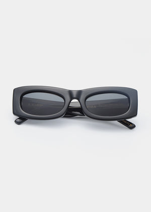 Black sunglasses on a light gray background