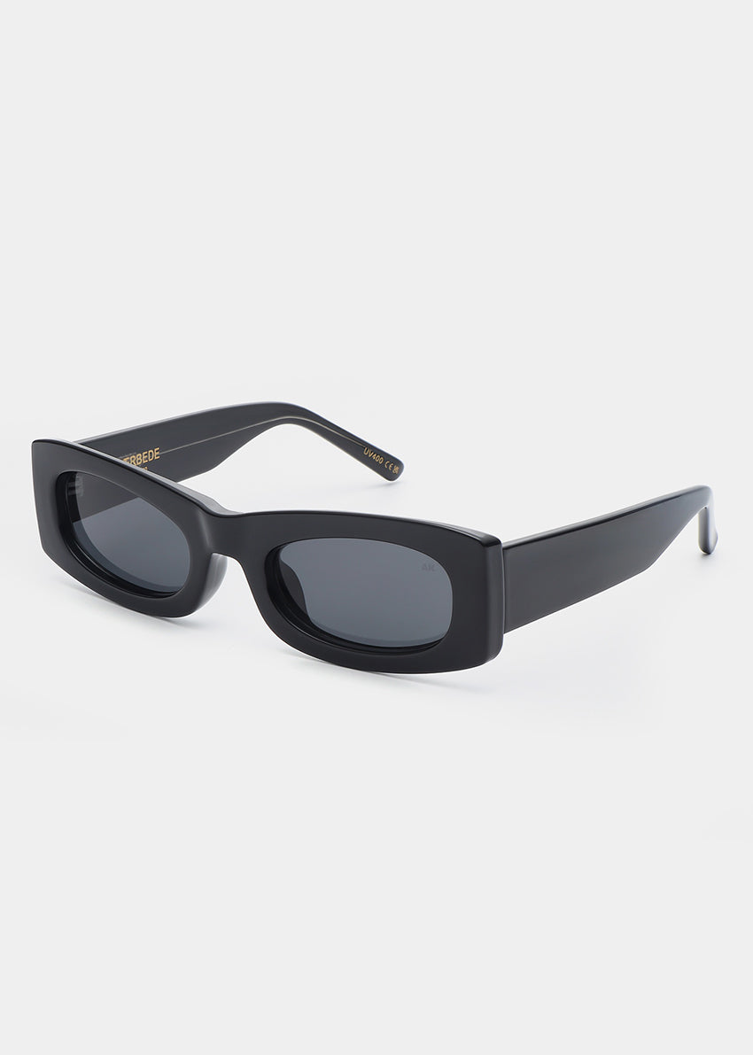 Black sunglasses with a thin frame on a white background