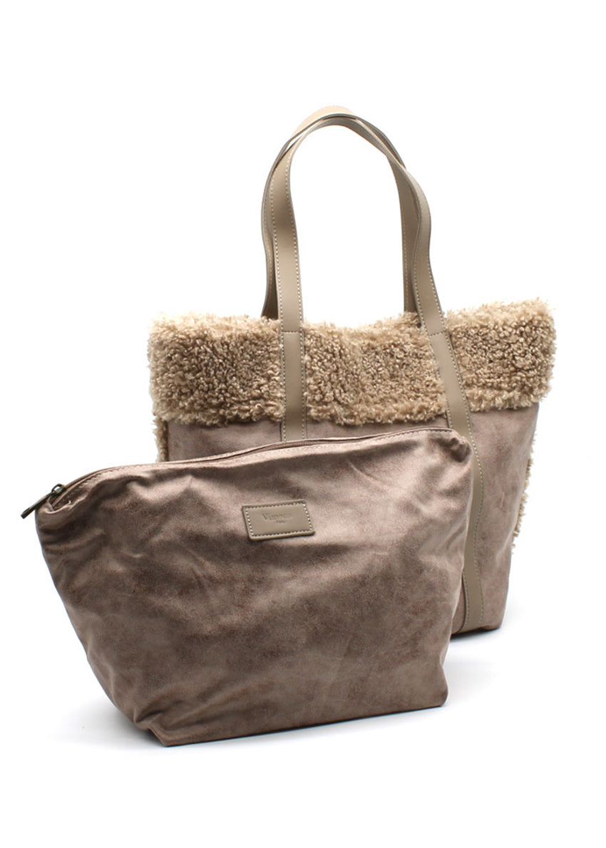 A beige suede tote bag with faux shearling trim, sturdy handles, and a spacious design.