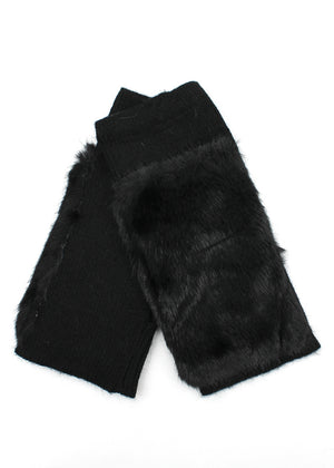 Black fur wrist warmers on a white background