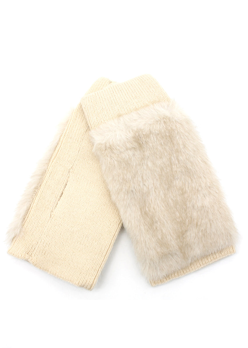 Cream-colored gloves with fur trim on a white background