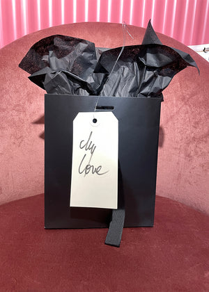 A black gift bag with a tag that reads 'My Love'.