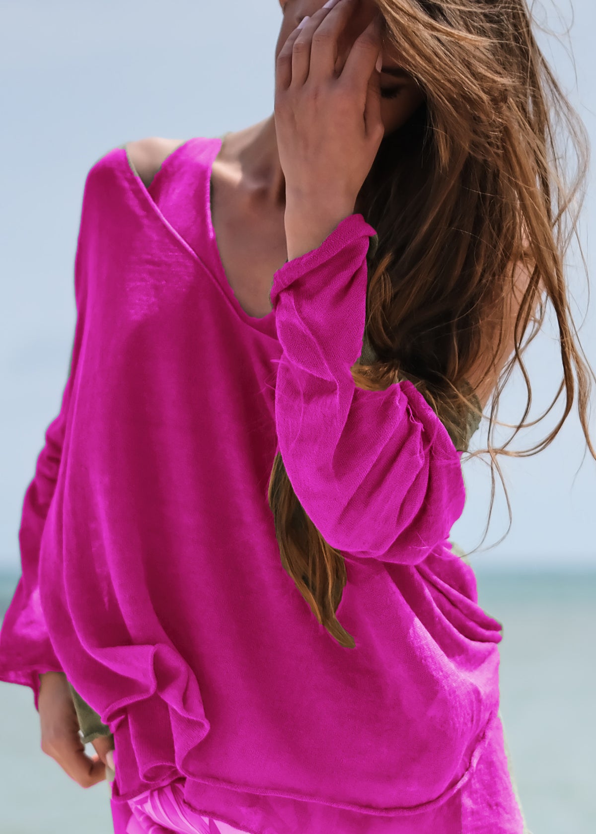 This stylishly funky yet timeless pullover features a medium length, deep V neckline on both sides, wide and relaxed fit, and long sleeves. It adds the perfect finishing touch to any casual look, and is effortlessly easy to pull on.