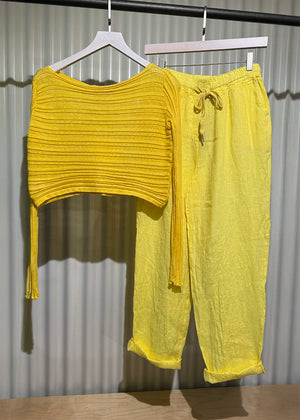 Yellow linen pants, designed for ultimate comfort and effortless style. Featuring a relaxed fit and an adjustable waistband with a drawstring, these pants offer a customizable fit that’s perfect for all-day wear