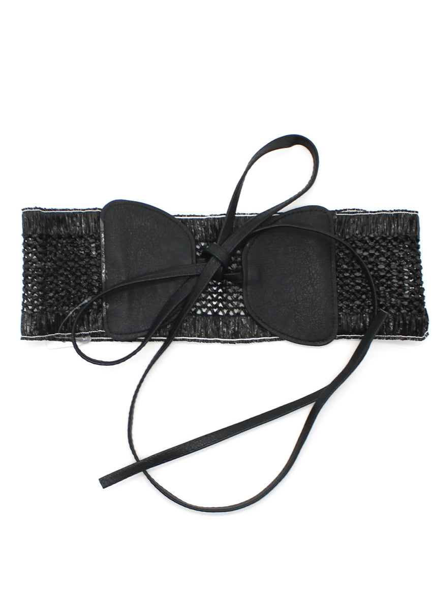 A handcrafted woven waist belt with a bow accent, featuring a soft black tone and an adjustable tie closure.