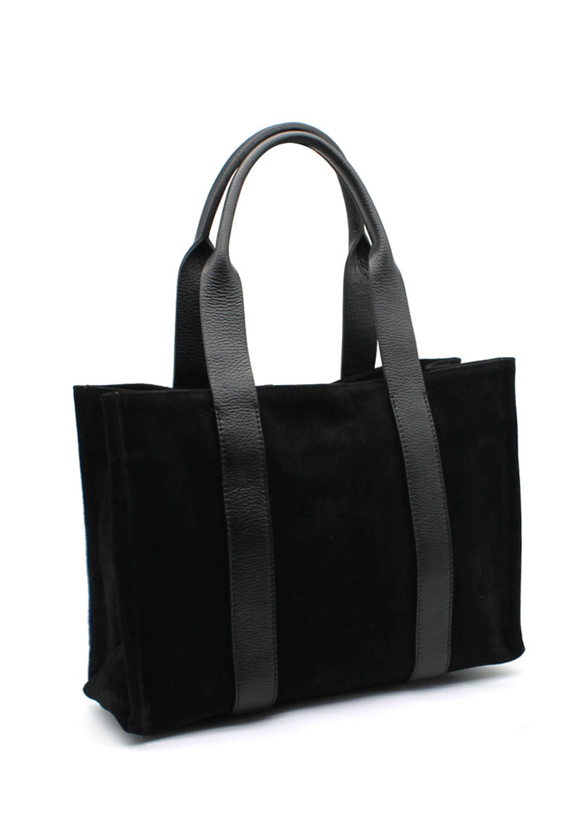 This elegant tote black bag features a minimalist design crafted from a luxurious combination of materials. The main body is made of suede, offering a soft, velvety texture, while the long, sturdy straps are made from pebbled leather
