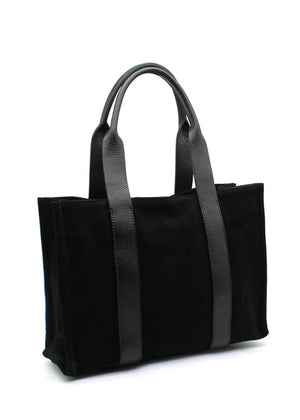 This elegant tote black bag features a minimalist design crafted from a luxurious combination of materials. The main body is made of suede, offering a soft, velvety texture, while the long, sturdy straps are made from pebbled leather
