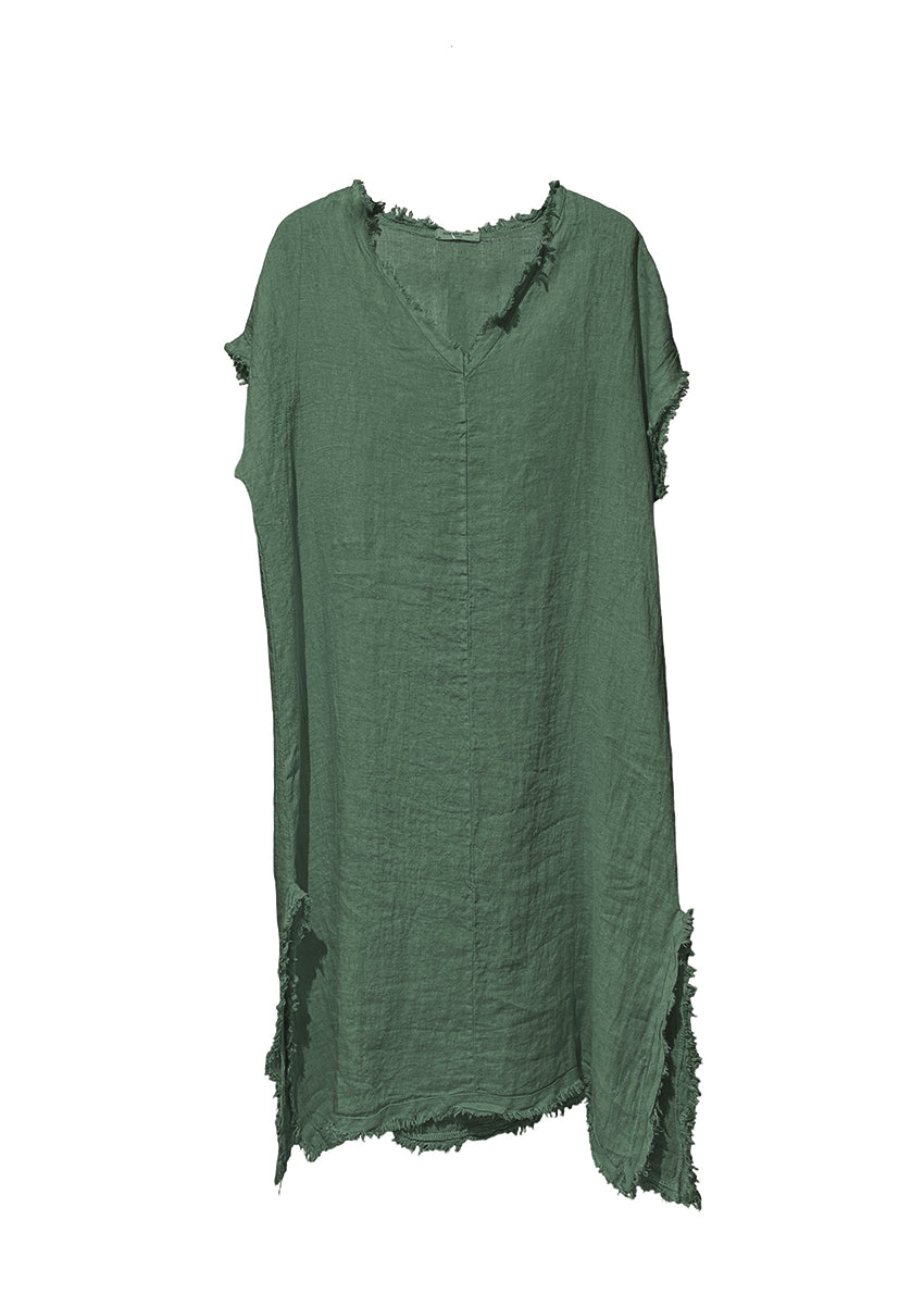 Green dress with frayed edges on a white background
