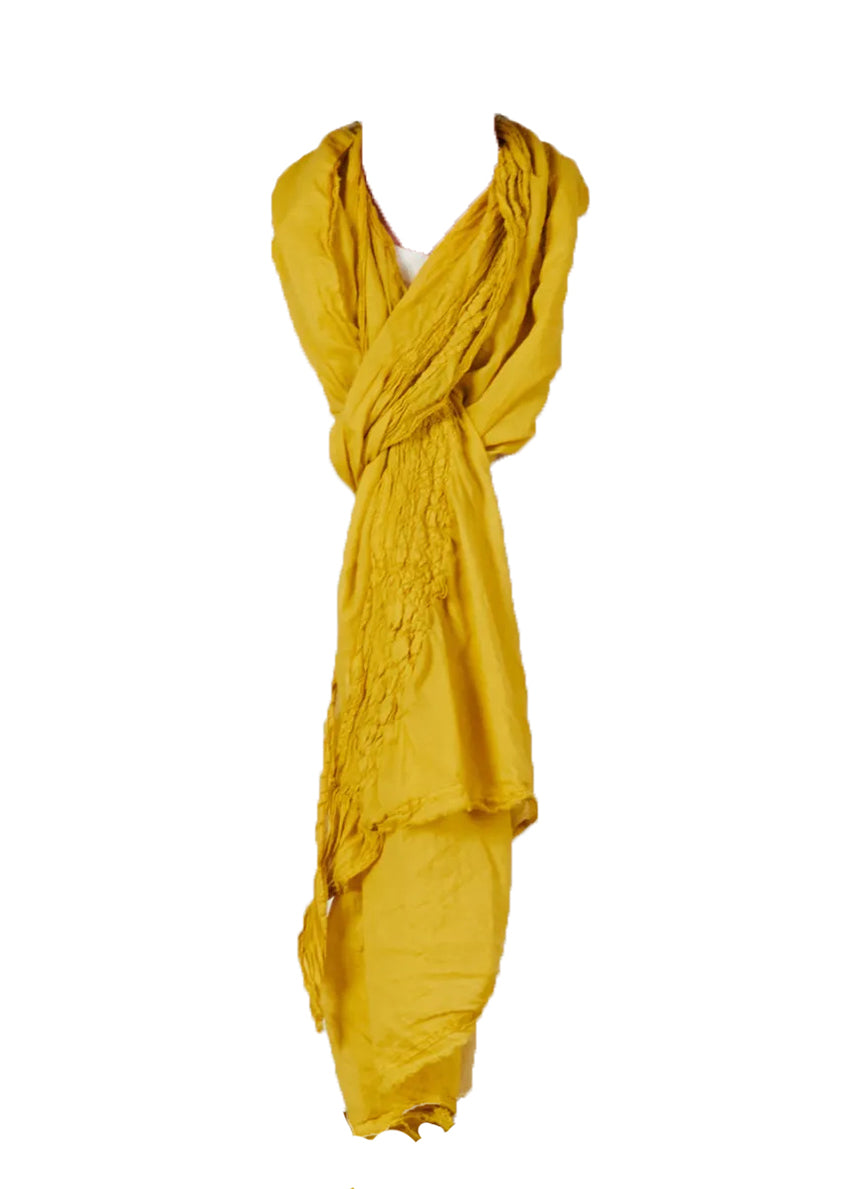 Unisex gold scarf with decorative stitching, made of soft cotton voile fabric, with frayed edges.