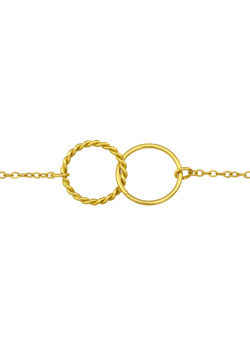 A gold-plated infinity symbol bracelet with a chain attached to each end.