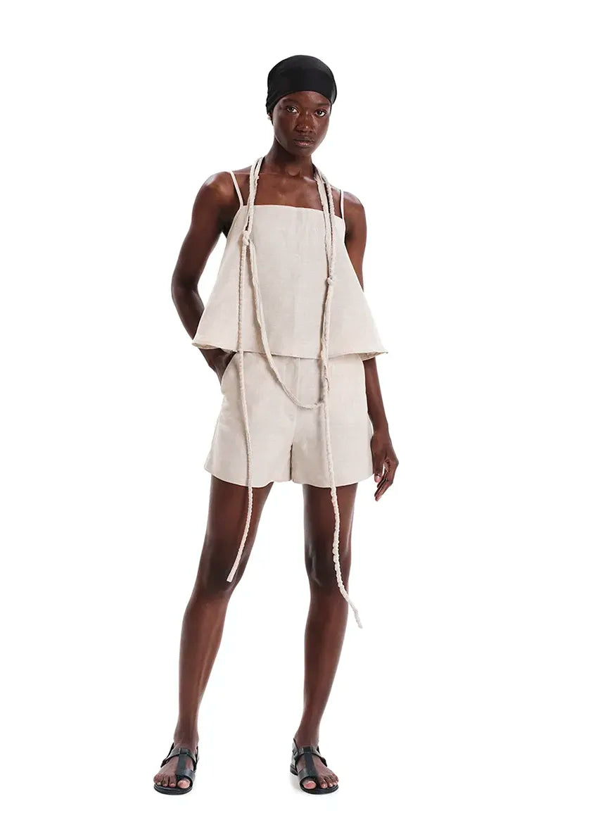 Long necklace made of cotton fabric with inner cord. A unique summer accessory whose fringes and length add a touch of style to every outfit.