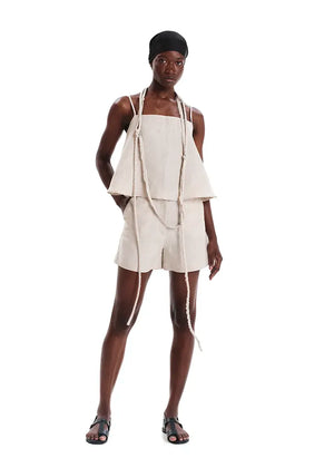 Long necklace made of cotton fabric with inner cord. A unique summer accessory whose fringes and length add a touch of style to every outfit.