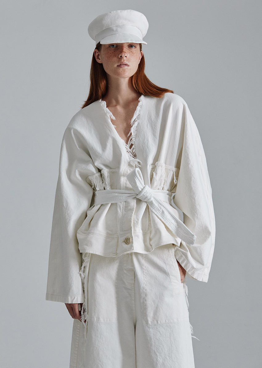 La Vaca Loca is a bold expression of individuality and modern style with a tailored heritage. Crafted from soft cotton , this robe- white belt it is an incredible item that ads chicness to any outfit.