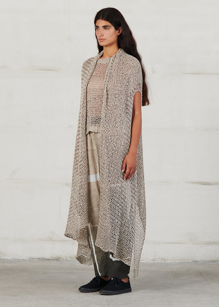Knit that feels like a hug, sweater- vest are updated this season in chunky and ribbed styles, cropped and/or longline cuts. Linen knit, with front opening this cardigan is perfect for colder days during summer, elegant cut and soft texture.