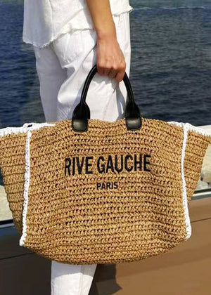 Discover the Rive Gauche Paper Bag – a simple, practical, and eco-friendly accessory. Made of 100% paper with dimensions H27 x L57 x D17 cm, perfect for summer looks. Eco-friendly bag, summer accessory, minimalist design, sustainable fashion accessory