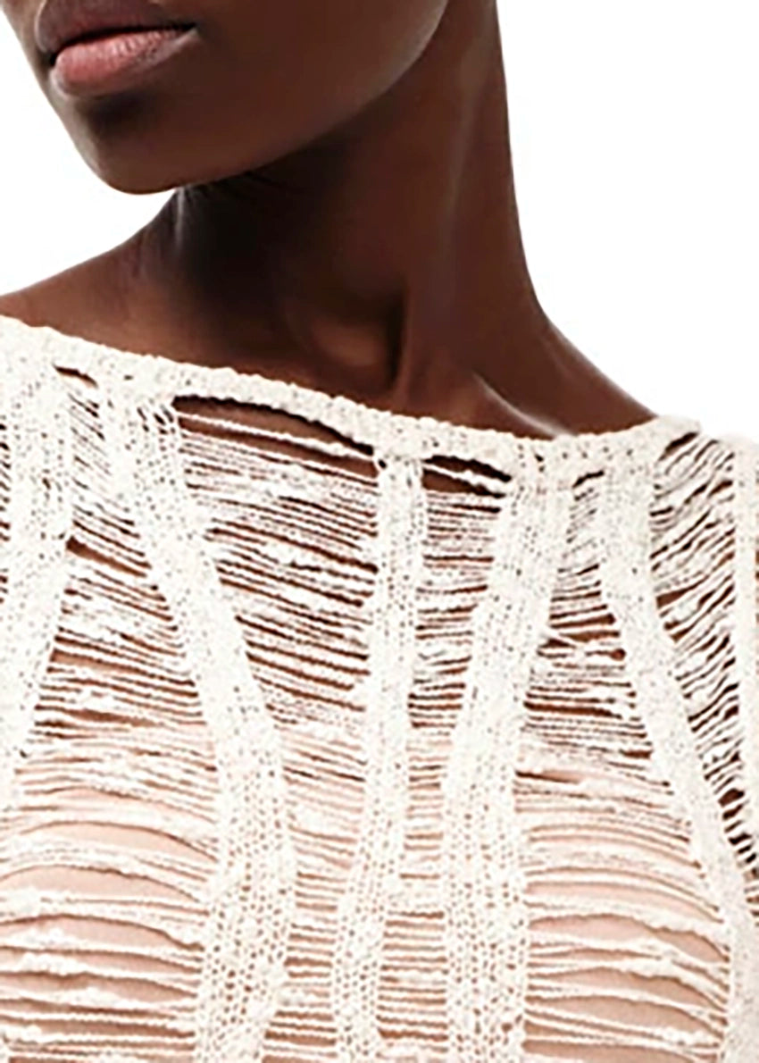 Mini transparent long sleeved white dress with perforated knitting stitch. Suitable for resort destinations