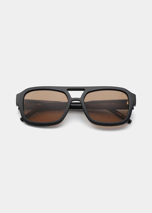Black sunglasses with brown lenses on a white background