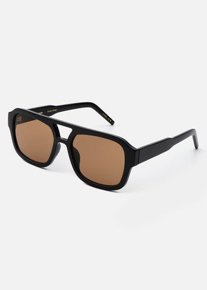Black sunglasses with brown lenses on a white background