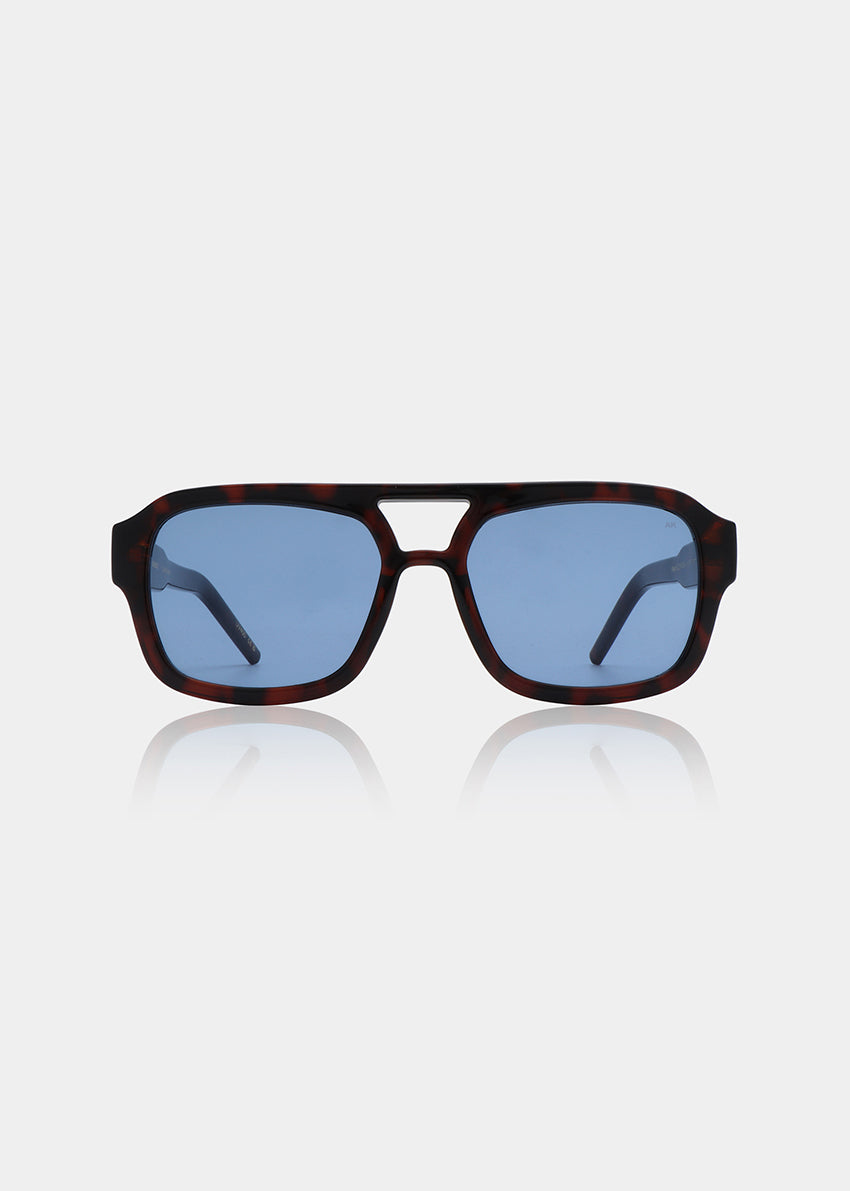 Sunglasses with a dark frame and blue lenses on a light gray background
