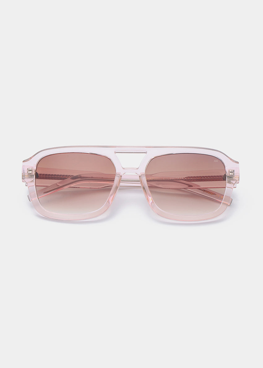 Pink sunglasses with gradient lenses on a white background