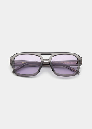 Sunglasses with purple lenses on a white background