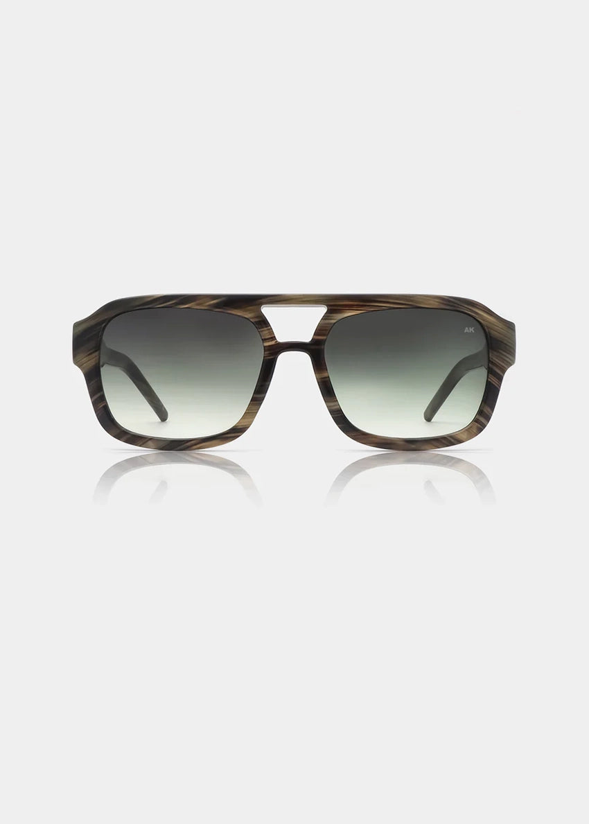 Sunglasses with tortoiseshell frame and gradient lenses on a white background