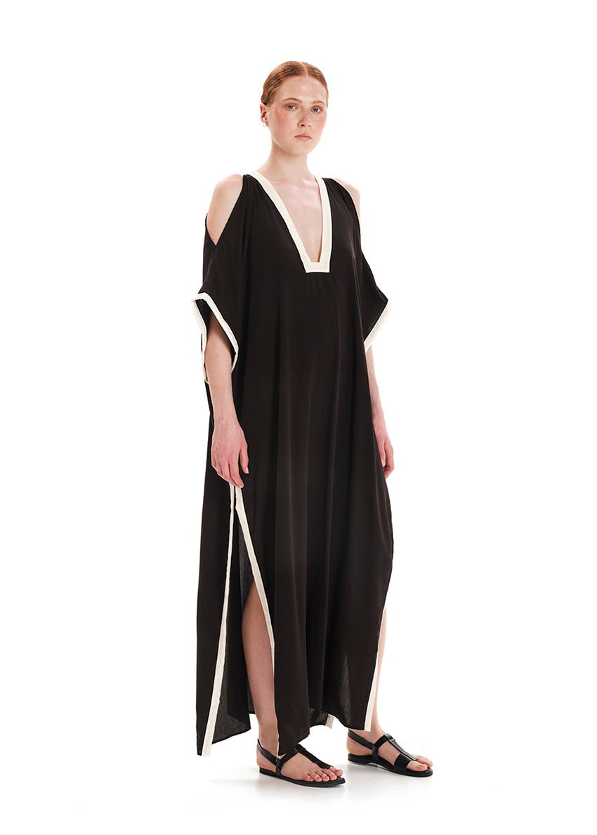 A  deep pink maxi length tunic with a v-neckline and bare shoulders made of soft rayon fabric.